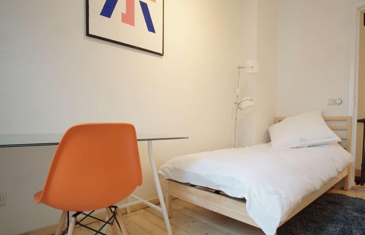 Sunny bedroom with single bed