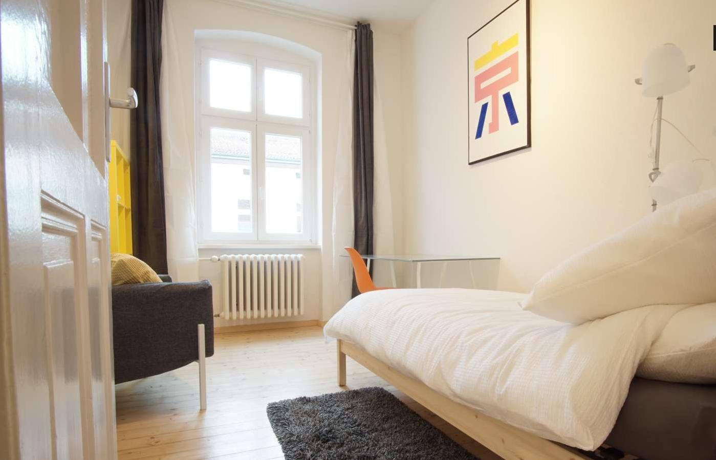 Sunny bedroom with single bed